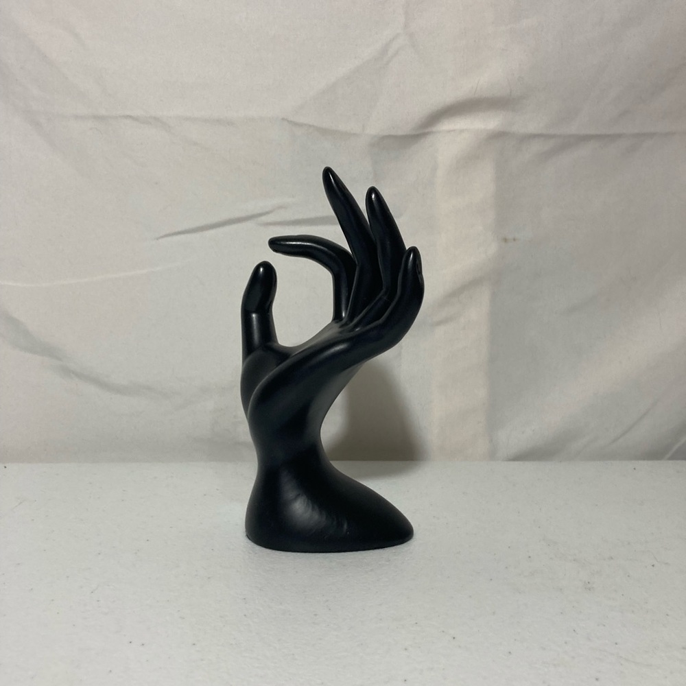 Black ring accessories hand. ring holder or decor.